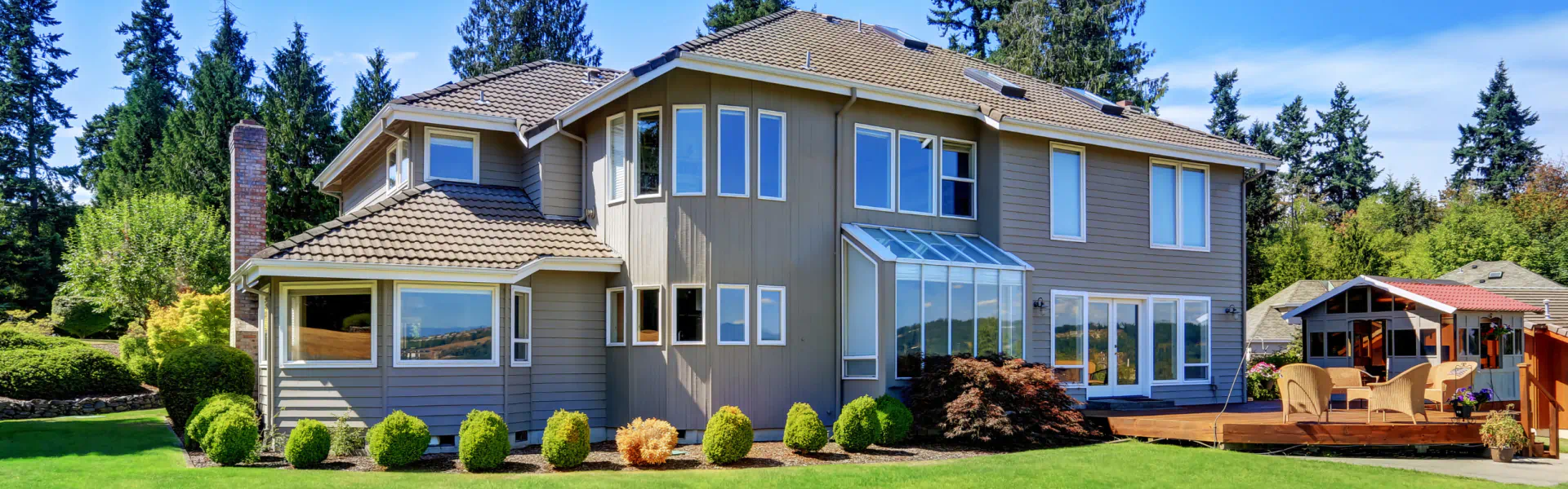 hero residential house with new siding and wooden deck